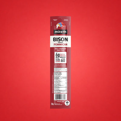 Single Original Strawberry Bison Pemmican strip on a red background