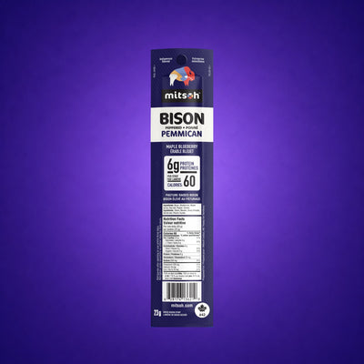 Single Peppered Blueberry Bison Pemmican strip on a deep purple background